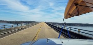 view of wooden kayak from truck windshield