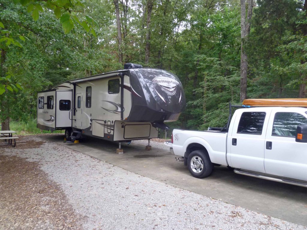 Campsite with RV parked at Corps of Engineer campground