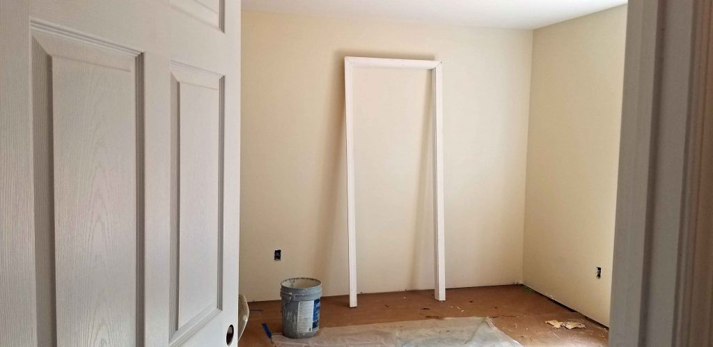 Installing doors and moulding before traim work is sut and installed.