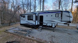 Brad Saum fifth wheel parked along a creek at Montgomery Bell Campground in Burns, TN.
