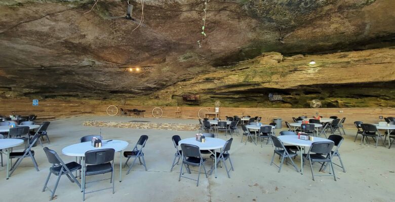 Dining tables for Rattlesnake Saloon in a cave.