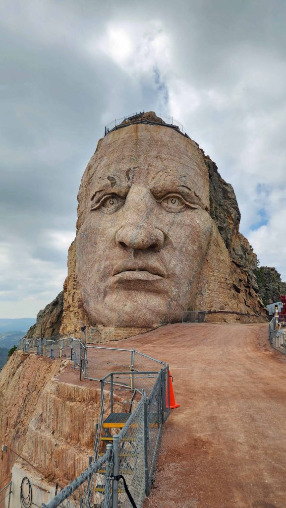 Close up of granite rock carving face of Crazy Horse Memorial.