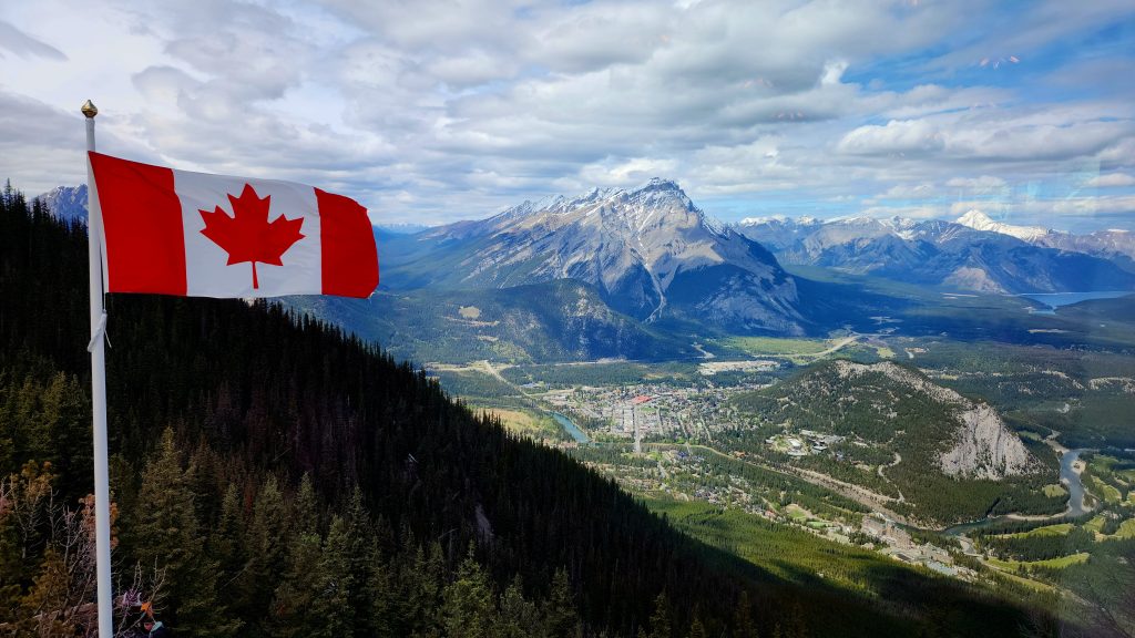 Canada flag over Banff community from high viewpoint