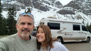 Brad Saum and Mary Beth Sampson in front of the pleasure way camper van